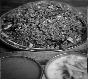 Kilma biriyani egg crampled and chicken pieces