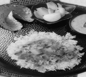 Rice With Aloo Tamatar Gravy & 1 Nos. Roasted Papad.