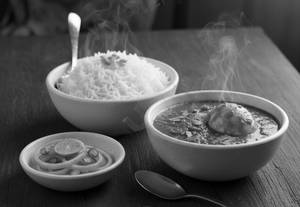 Egg Curry With Rice And Salad Meal