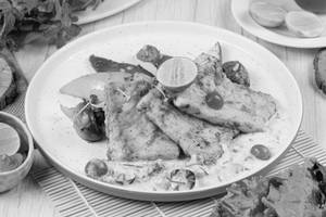 Grilled fish creamy wine sauce