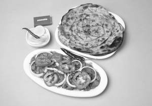 Chole (reg/jain) With 1 Lacha Parantha Or Butter Naan