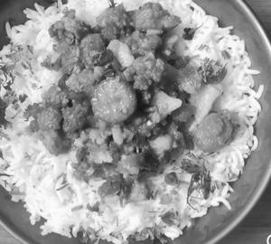 Basmati Rice With Marwadi Moong Wadi & 1 Nos. Roasted Papad.