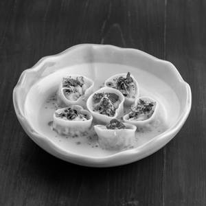 Chicken and porcini mushroom agnolotti in parmesan brodo