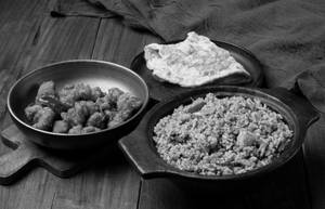 Kozhi Vada Satti Soru Served With Omelette And Chicken 65