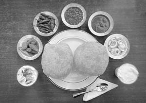 1 Plate Paneer Wale Chole Bhature + 1 Lassi