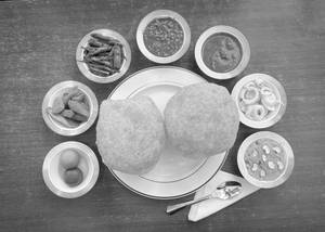 2 Bedmi Poori + Aloo Sabzi 1 Plt Suji Halwa