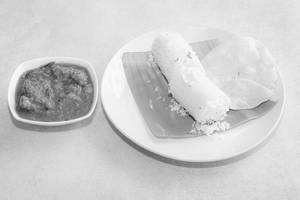 Puttu With Chicken Curry And Pappadam