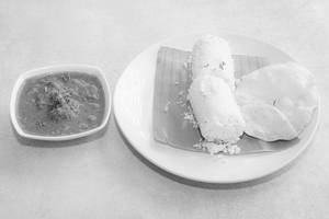 Puttu With Fish Curry And Pappadam.