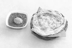 Porotta( 2 Pcs) With Mutta Curry