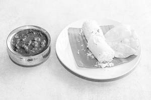 Puttu With  Erachi Roast And Pappadam