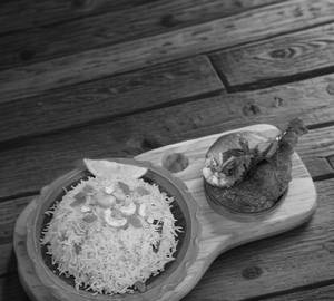 Basanti pulao with chicken kosha serves 1