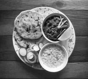 2 Amritsari Kulcha With Chole And Raita