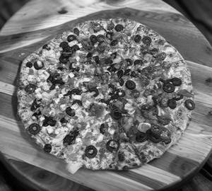 Green house with spicy pizza