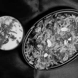 T.g Special Veg Biryani (with Raita)