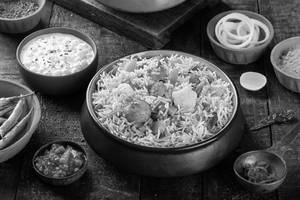Veg Dum Biryani Served Raita & Salad