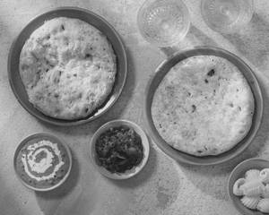 Mutton Achaari Kulcha With White Butter, Dal Makhani & Tomato Murabba