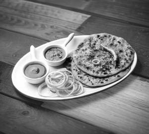 Onion Paratha(4) Salad, Pickle , Curd