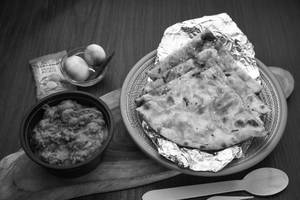 Masala Kulcha (1 Pc) + Mushroom Masala + Pickles + Onions (serves 1)