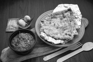 Masala Kulcha (1 Pc) + Dum Aloo + Pickles + Onions (serves 1)