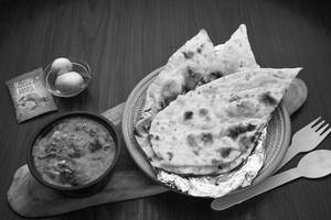 Butter Naan (1 Pc) + Muttar Paneer + Pickles + Onions (serves 1)