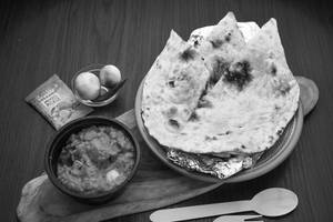 Butter Naan (1 Pc) + Aloo Do Pyaja + Pickles + Onions (serves 1)