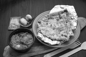 Masala Kulcha (1 Pc) + Aloo Do Pyaja + Pickles + Onions (serves 1)