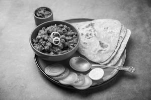 Any Paratha (sattu/wheat/panner/aloo) + Chole