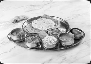 Wholesome Meal Box (2 Veggies+ 1 dal+ 1 rice dish+ 2 chapati+ 1 sweet+ papad & salad)