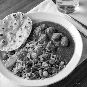 Sev Tamatar + Tawa Butter Roti (2 Pcs) + Veg Pulao