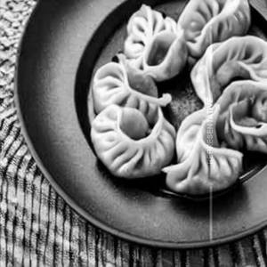 Pan fried momos in schezwan sauce