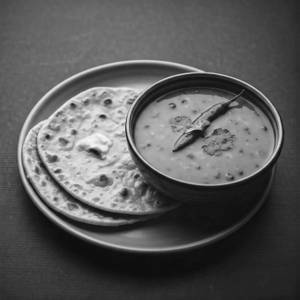 Dal tadka + 2 Butter tawa roti                           