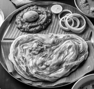 Vechu Parotta + Egg Malabar Varuval