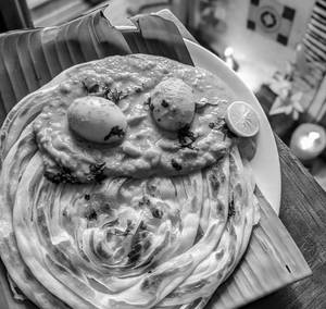 Parotta(2pc) + Egg Malabar Varuval