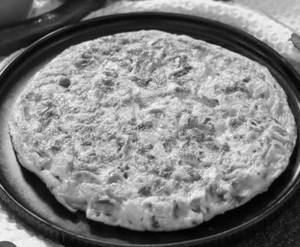 Stuffed Butter masala omelet with two butter paratha's and buttermilk