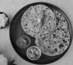 Two Butter paneer masala Paratha's with curd,mint chutney pickles and salad