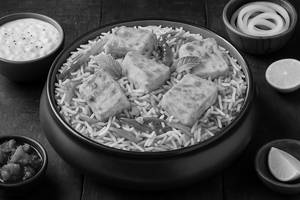 Paneer Tikka Biryani Served with Raita and Salad