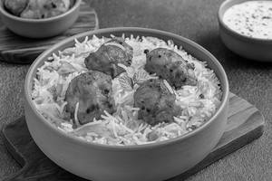 chicken Tikka Biryani Served with Raita and Salad.