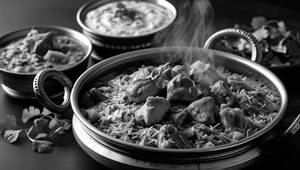 Chicken Tikka Handi Biryani With[Raita+Gravy]