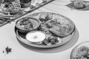 Chicken Biryani and Butter Chicken Thali.
