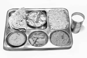 "Full Gujarati Thali (2 Sabzi+5 Roti + Dal + Rice+Salad + Chaas)"               