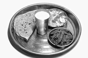 1 Veg Sabji + 4 Roti + Chaas + Salad
