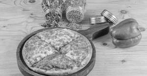 Chicken loaded momos pizza
