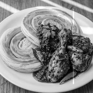 2 Parotta With Pepper Chicken Gravy