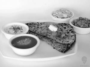 Tandoori Aloo Pyaaz Paratha With Dal Makhani