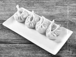 Chicken cheese momos steams