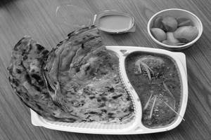 Egg Curry Garlic Laccha Paratha Combo Meal