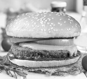 Schezwan Aaloo Tikki Cheese Burger