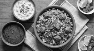 Soyabean Matar Biryani(served With Raita And Gravy)