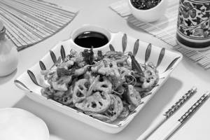 Crispy Lotus Stem With Curry Leaves And Black Pepper (Mc)