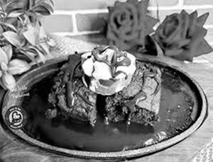 Chocolate Sizzling Brownie With Chocolate Sauce And Ice Cream And Cherry With Dryfruits